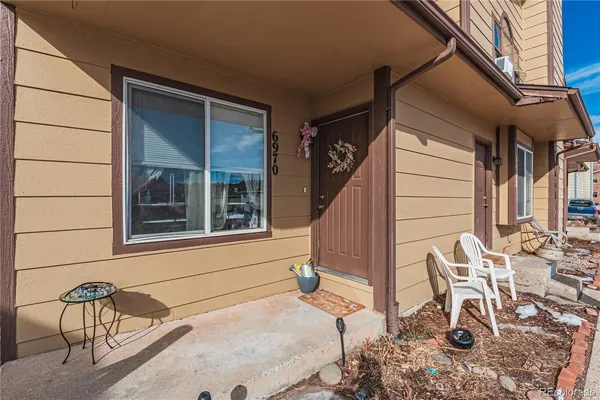 a view of house with outdoor seating space