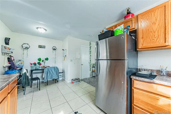 a living room with furniture a fireplace and a large mirror