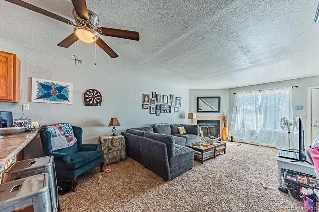 a view of a hallway with white walls and stairs