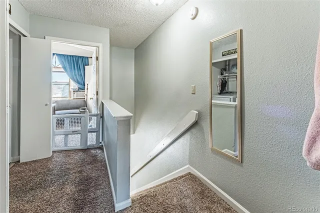 a bedroom with a bed and a mirror