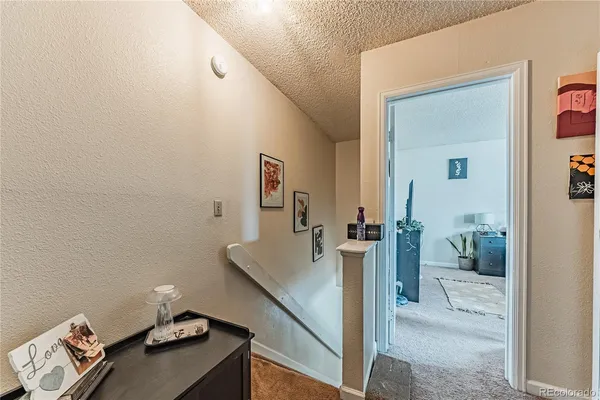 a bedroom with a bed chair and a window