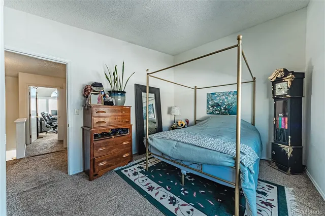 a bed room with a bed and a dresser