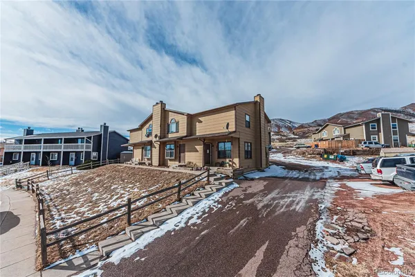 a front view of a building with a lot of windows