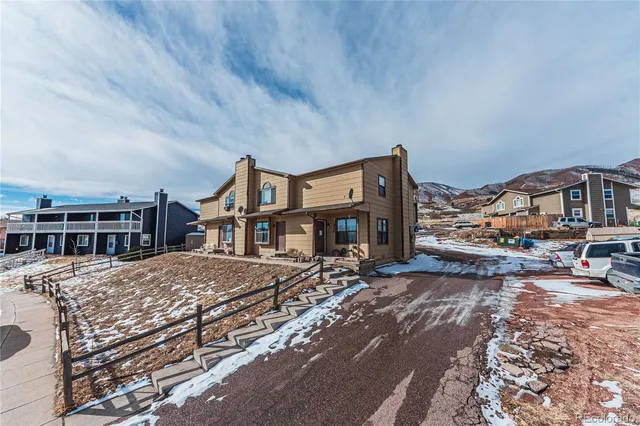 a front view of a building with a lot of windows