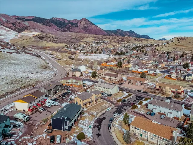 an aerial view of a house with a yard