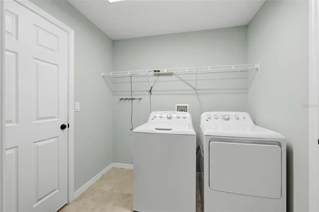 a bathroom with a granite countertop sink double and mirror
