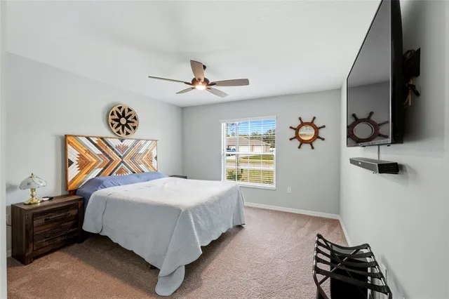 a view of a patio with table and chairs and potted plants
