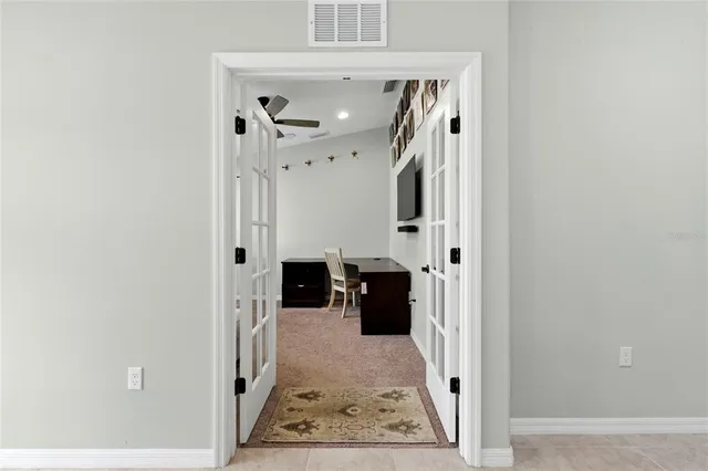 a view of a livingroom with furniture and a flat screen tv