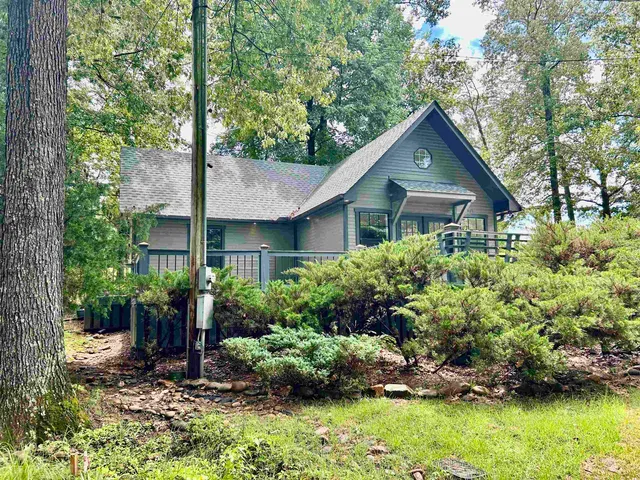 a house is sitting in middle od the garden