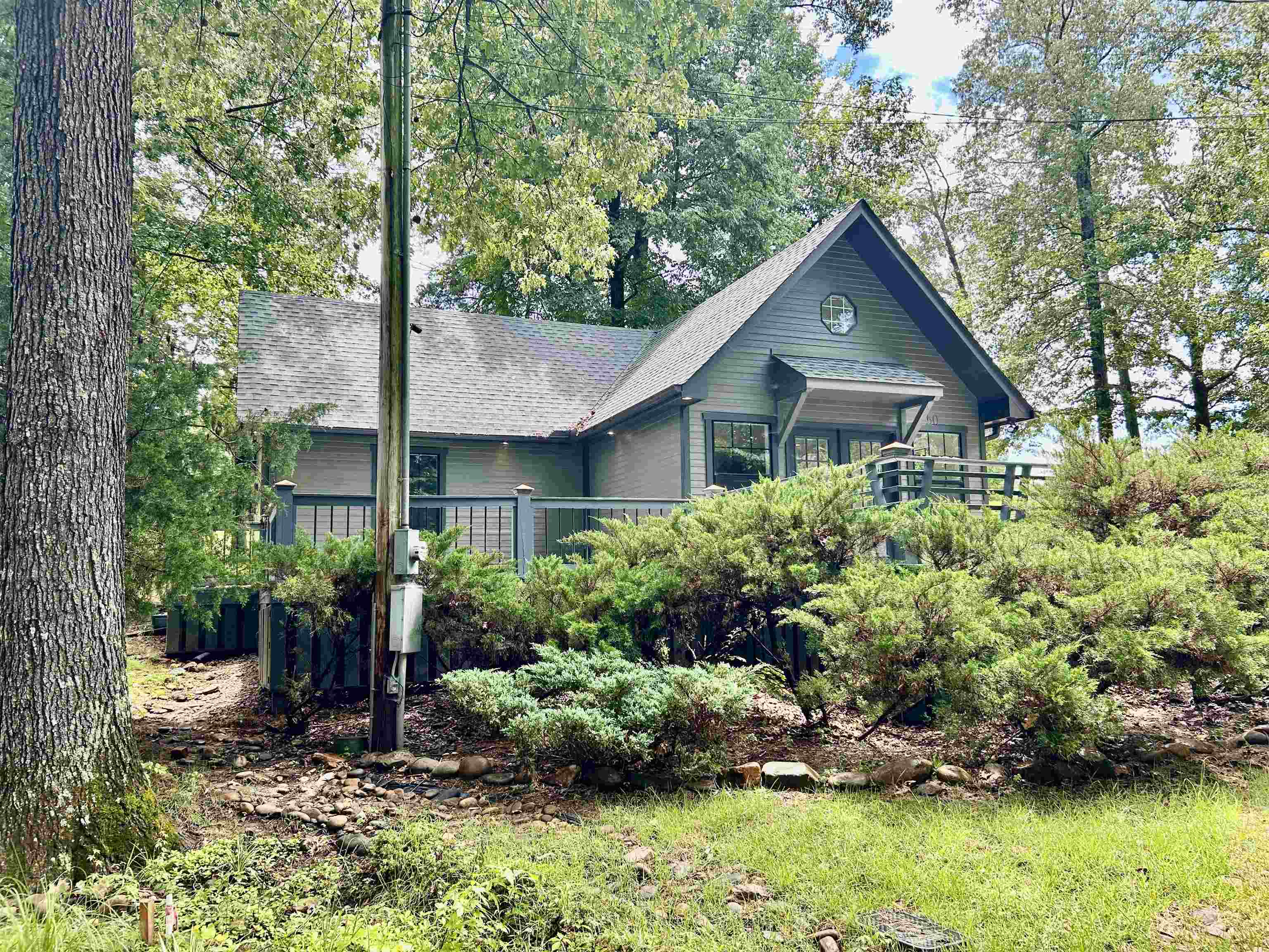 50 Haines Drive Iuka, MS 35616 - Photo 5 of 13 a house is sitting in middle od the garden