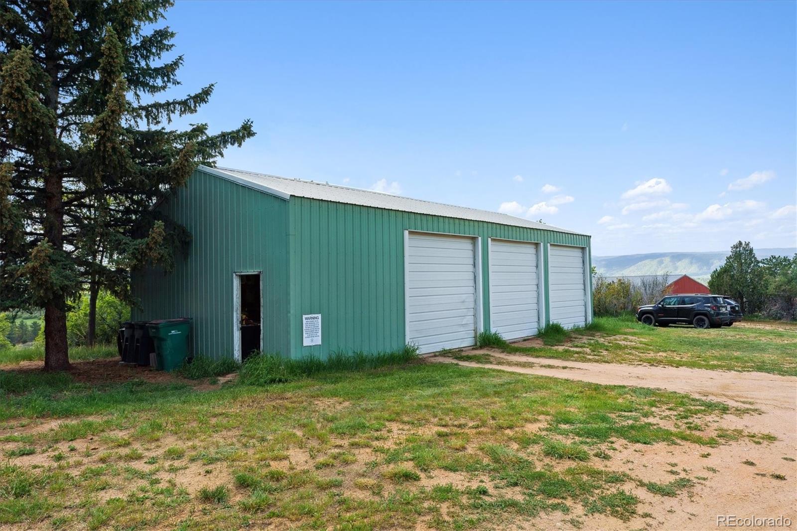 2938 West Wolfensberger Road Sedalia, CO 80135 - Photo 11 of 50 a backyard of a house