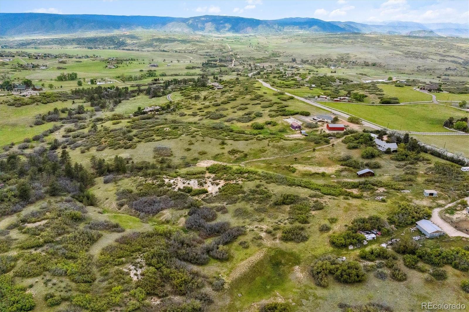 2938 West Wolfensberger Road Sedalia, CO 80135 - Photo 15 of 50 a view of city and ocean
