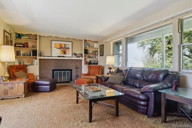 a kitchen with stainless steel appliances granite countertop a sink a stove and microwave