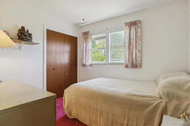 a living room with furniture a ceiling fan and a window