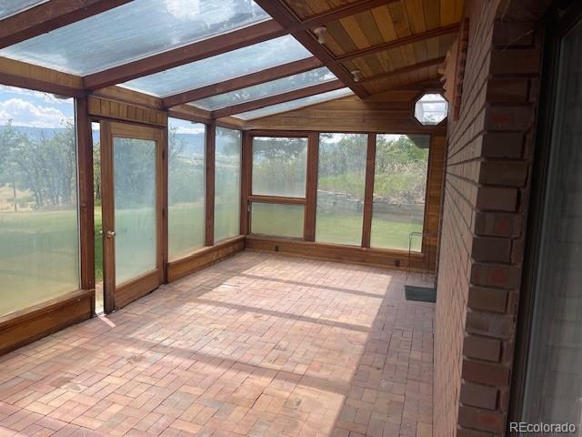 2938 West Wolfensberger Road Sedalia, CO 80135 - Photo 46 of 50 a view of an empty room with a window and an entrance