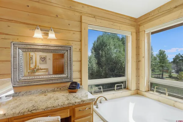 a view of a living room and bathroom