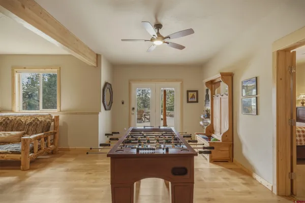 a living room with a stove and a table