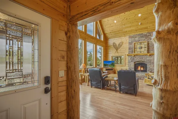 a view of a livingroom with furniture window and wooden floor