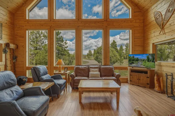 a living room with furniture and a large window