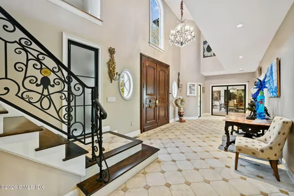a living room with furniture fireplace and a rug