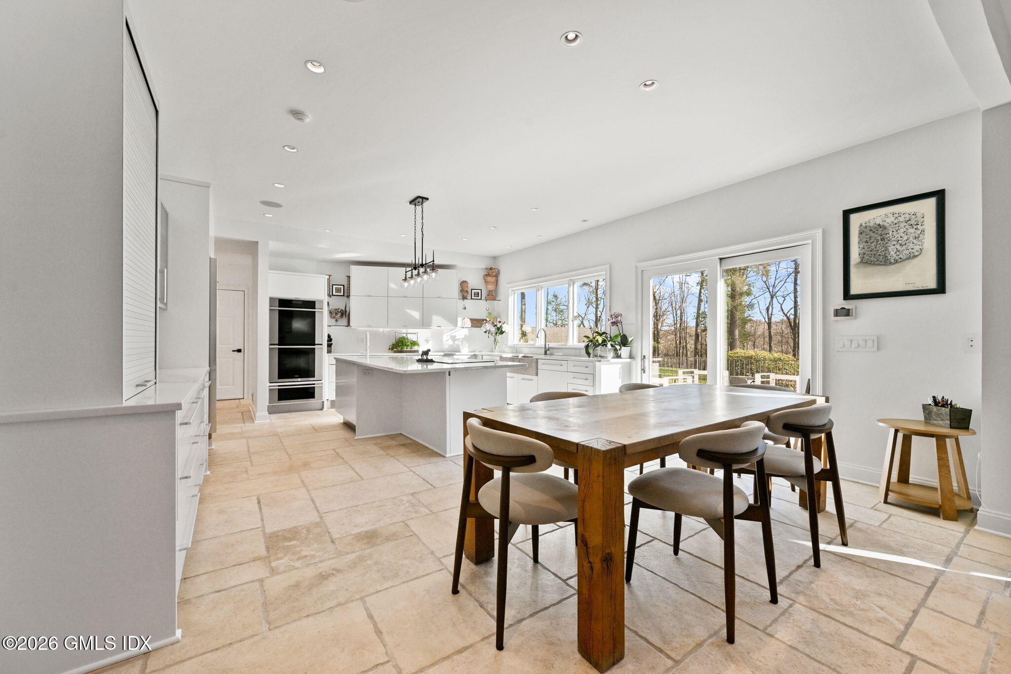367 Riversville Road Greenwich, CT 06831 - Photo 2 of 66 a kitchen with stainless steel appliances kitchen island granite countertop a table chairs sink and cabinets