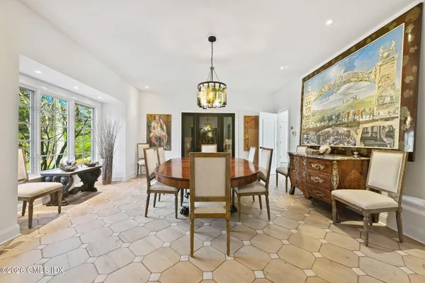 a kitchen with stainless steel appliances kitchen island granite countertop a sink and cabinets