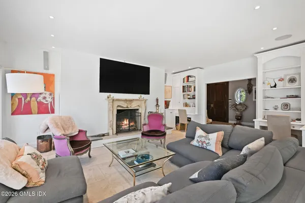 a spacious bedroom with a bed and a couch