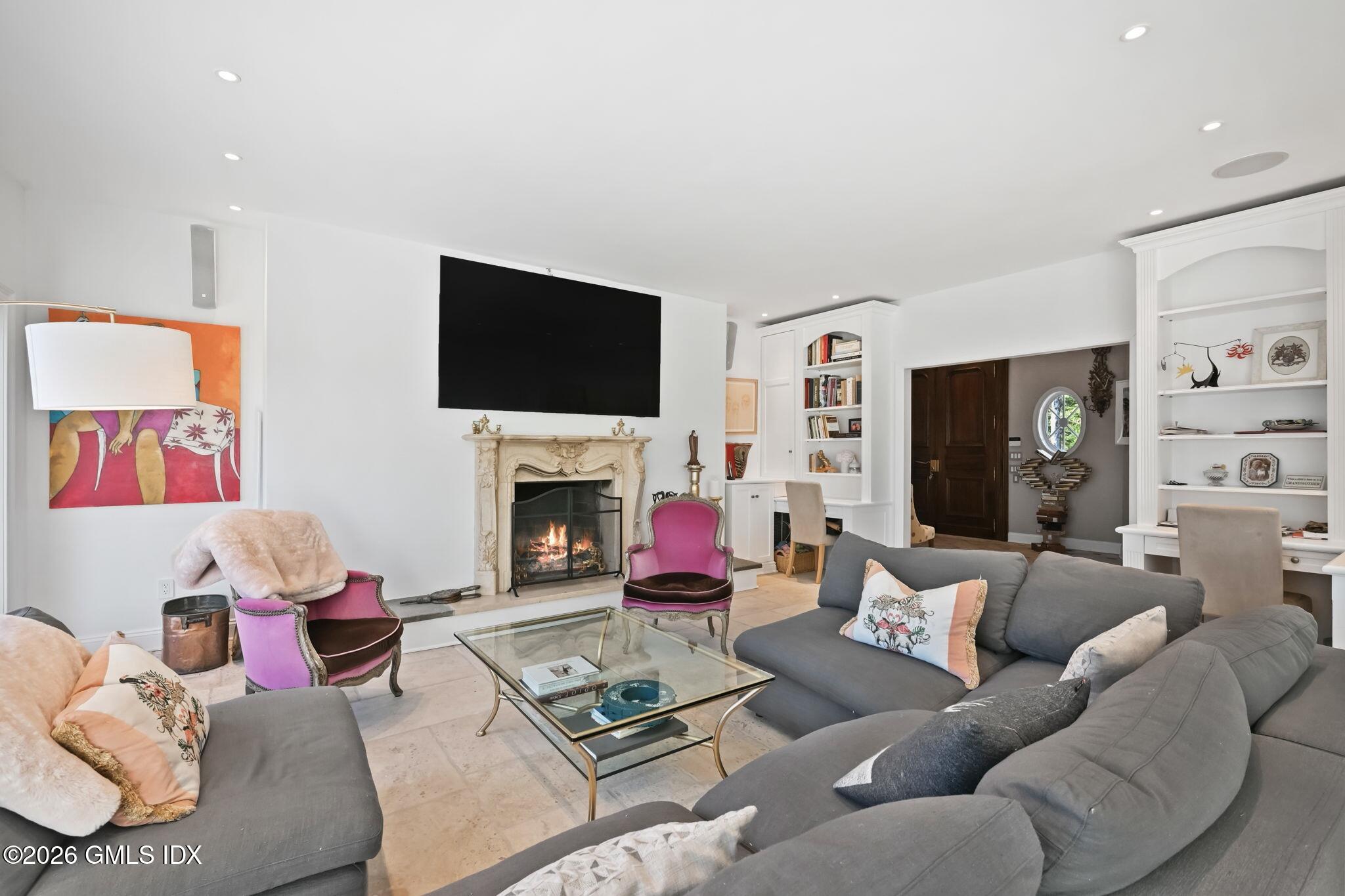 367 Riversville Road Greenwich, CT 06831 - Photo 25 of 66 a living room with furniture fireplace and flat screen tv