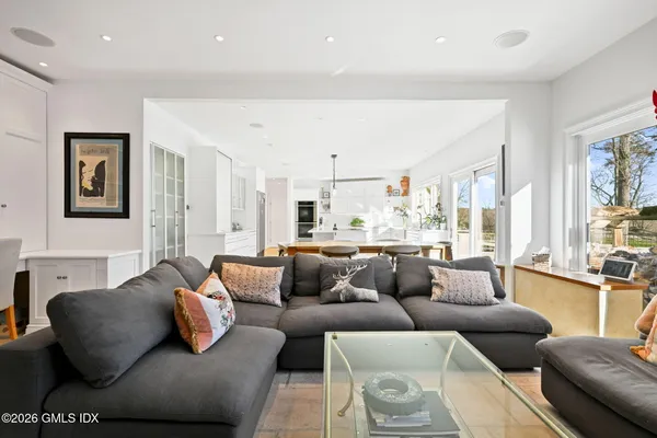 a bedroom with a bed and a view of kitchen