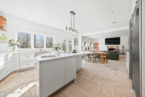 a bathroom with a sink mirror vanity and toilet