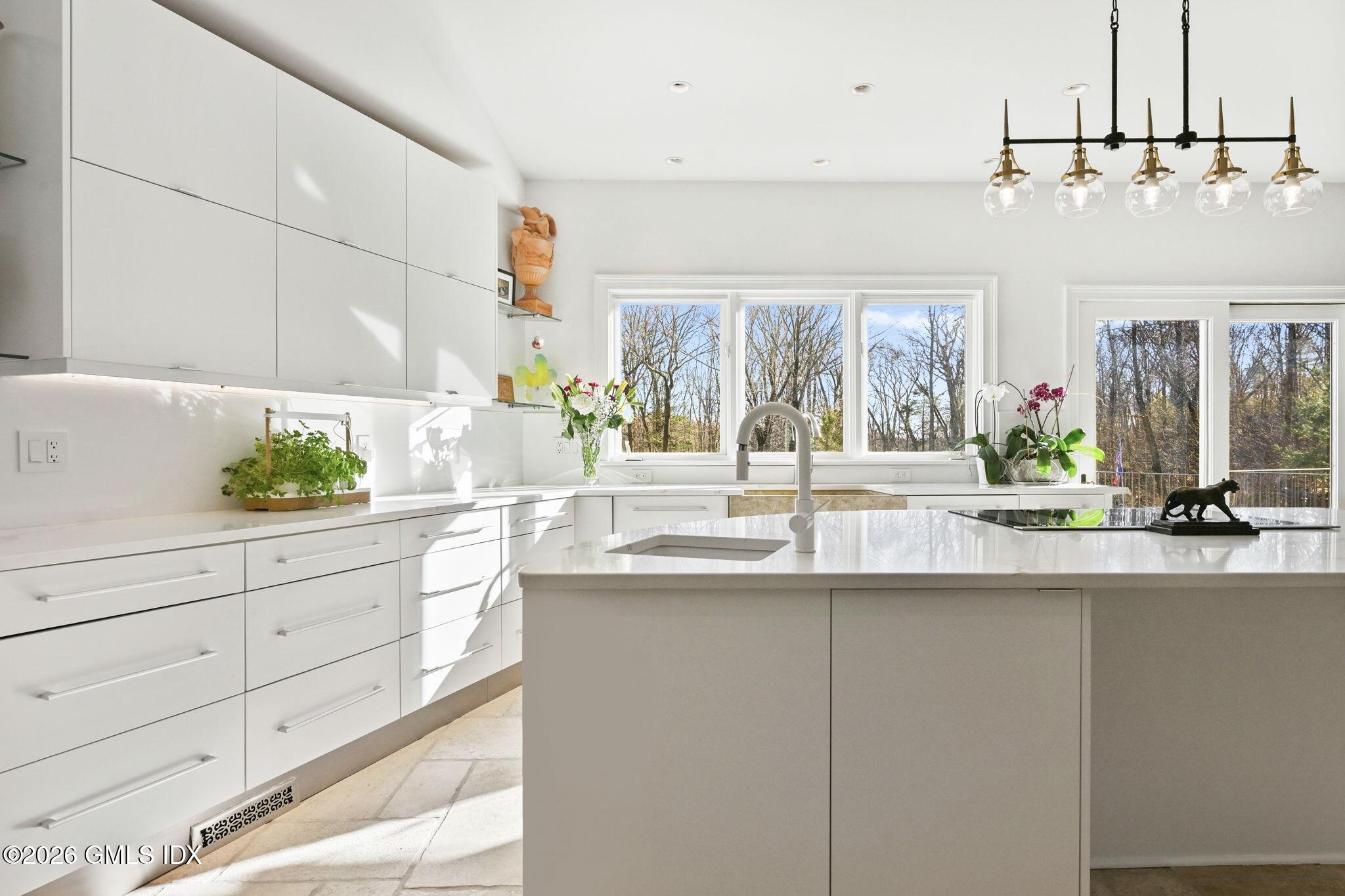 367 Riversville Road Greenwich, CT 06831 - Photo 30 of 66 a kitchen with a sink and cabinets
