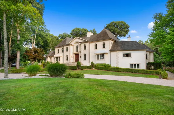 a view of a park with large trees