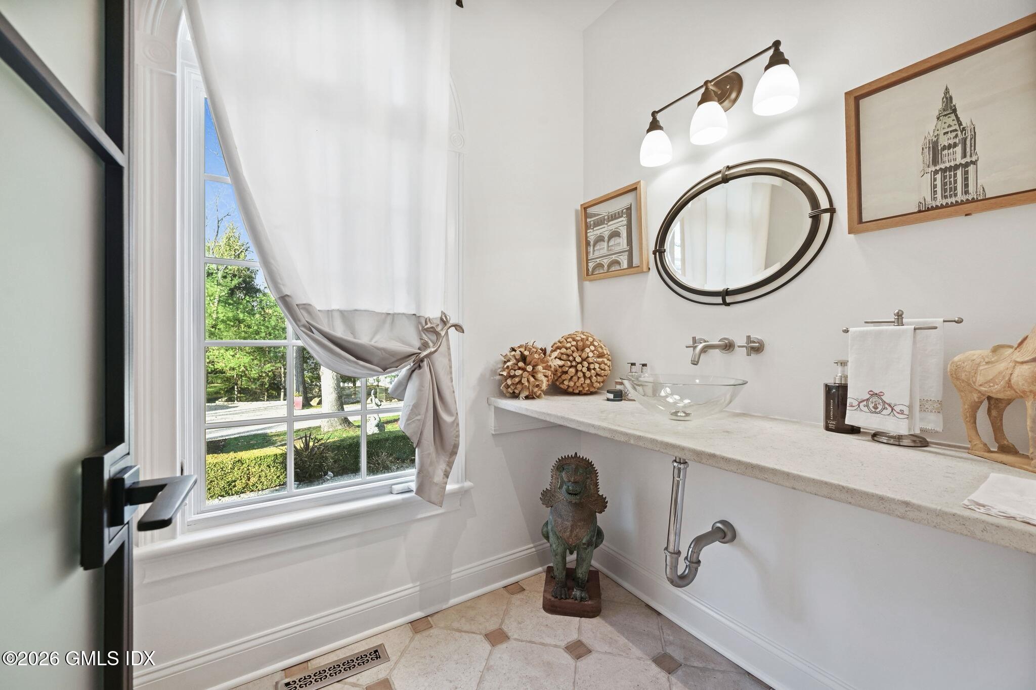 367 Riversville Road Greenwich, CT 06831 - Photo 33 of 66 a bathroom with a sink and a mirror