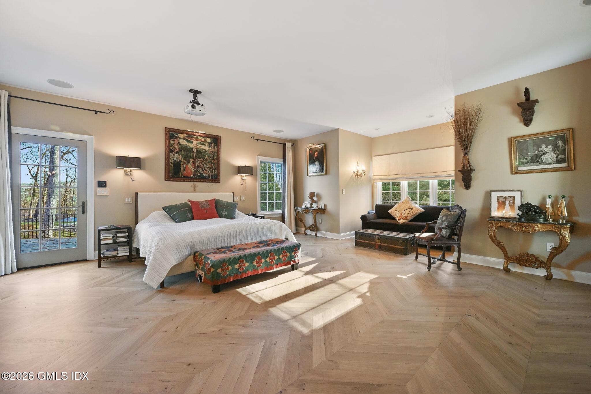 367 Riversville Road Greenwich, CT 06831 - Photo 35 of 66 a spacious bedroom with a bed and a couch