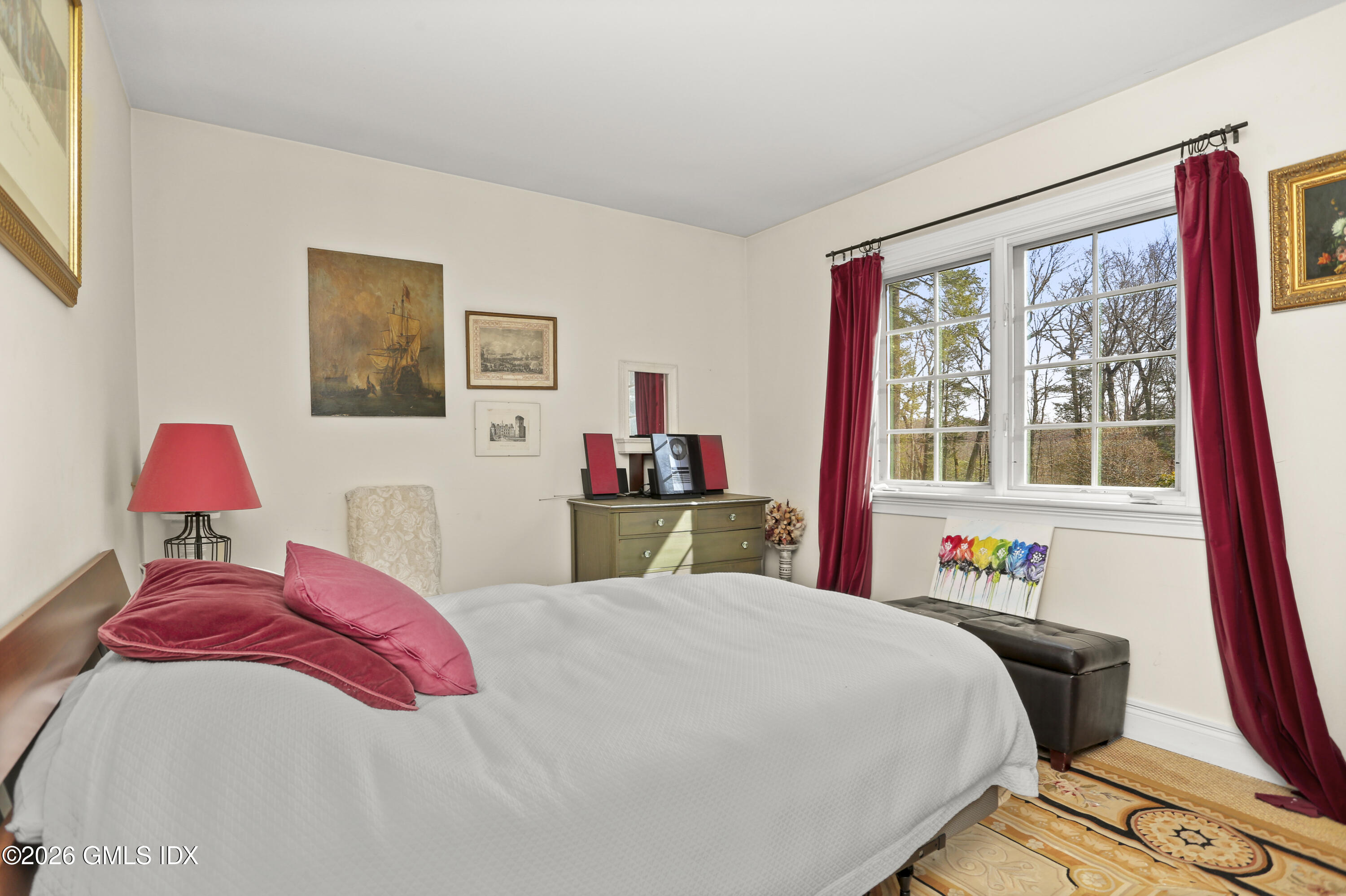 367 Riversville Road Greenwich, CT 06831 - Photo 40 of 66 a bedroom with a bed and a large window with the outer view