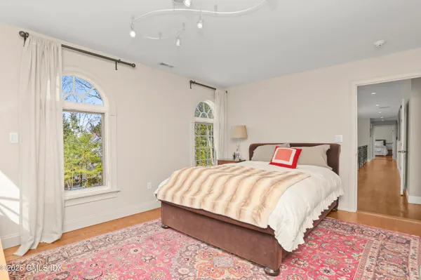 a view of a patio with a table and chairs and potted plants