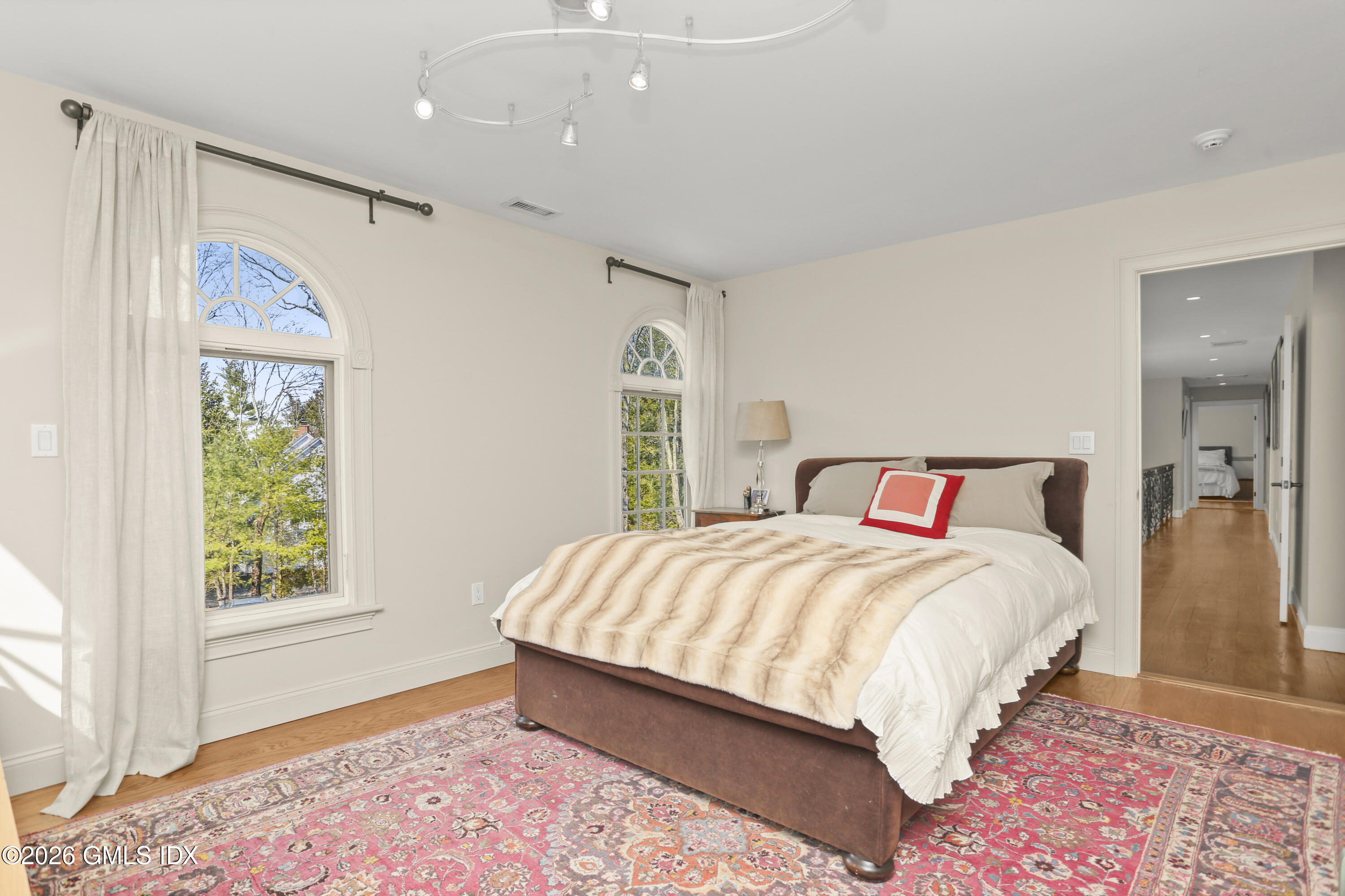 367 Riversville Road Greenwich, CT 06831 - Photo 43 of 66 a bedroom with a large bed and a window