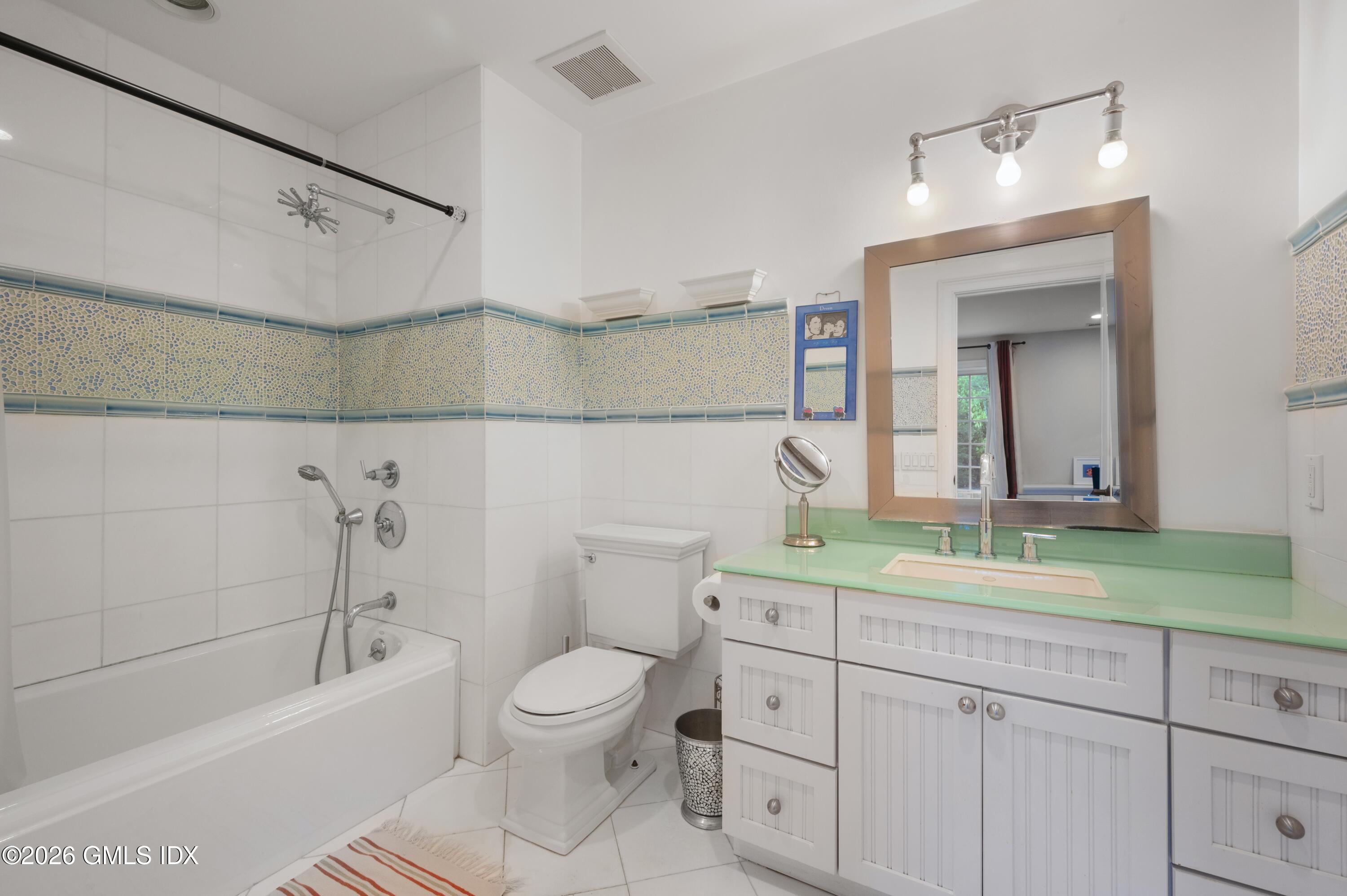 367 Riversville Road Greenwich, CT 06831 - Photo 45 of 66 a bathroom with a sink a toilet and a bathtub
