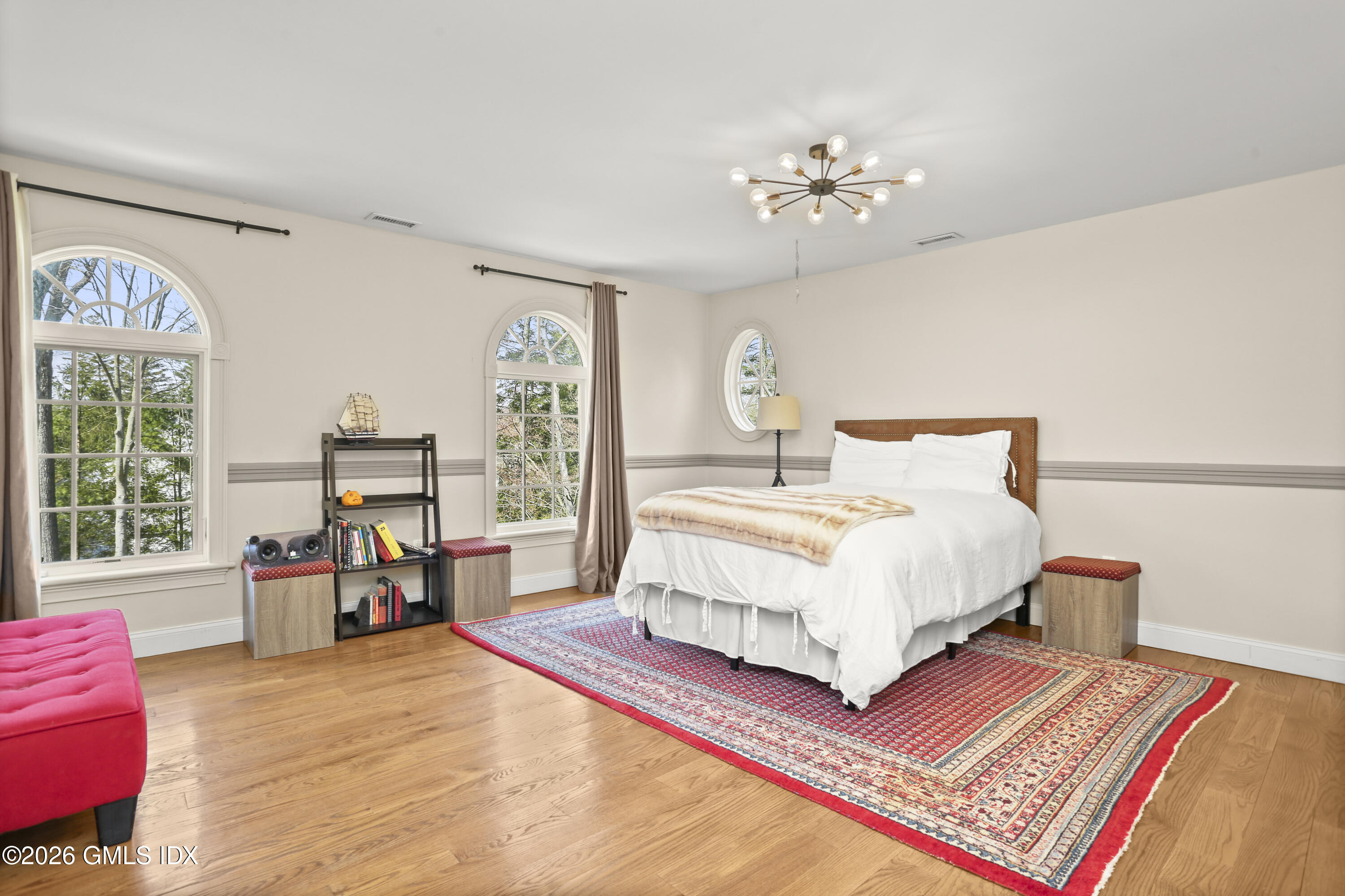 367 Riversville Road Greenwich, CT 06831 - Photo 48 of 66 a bedroom with a large bed and a large window