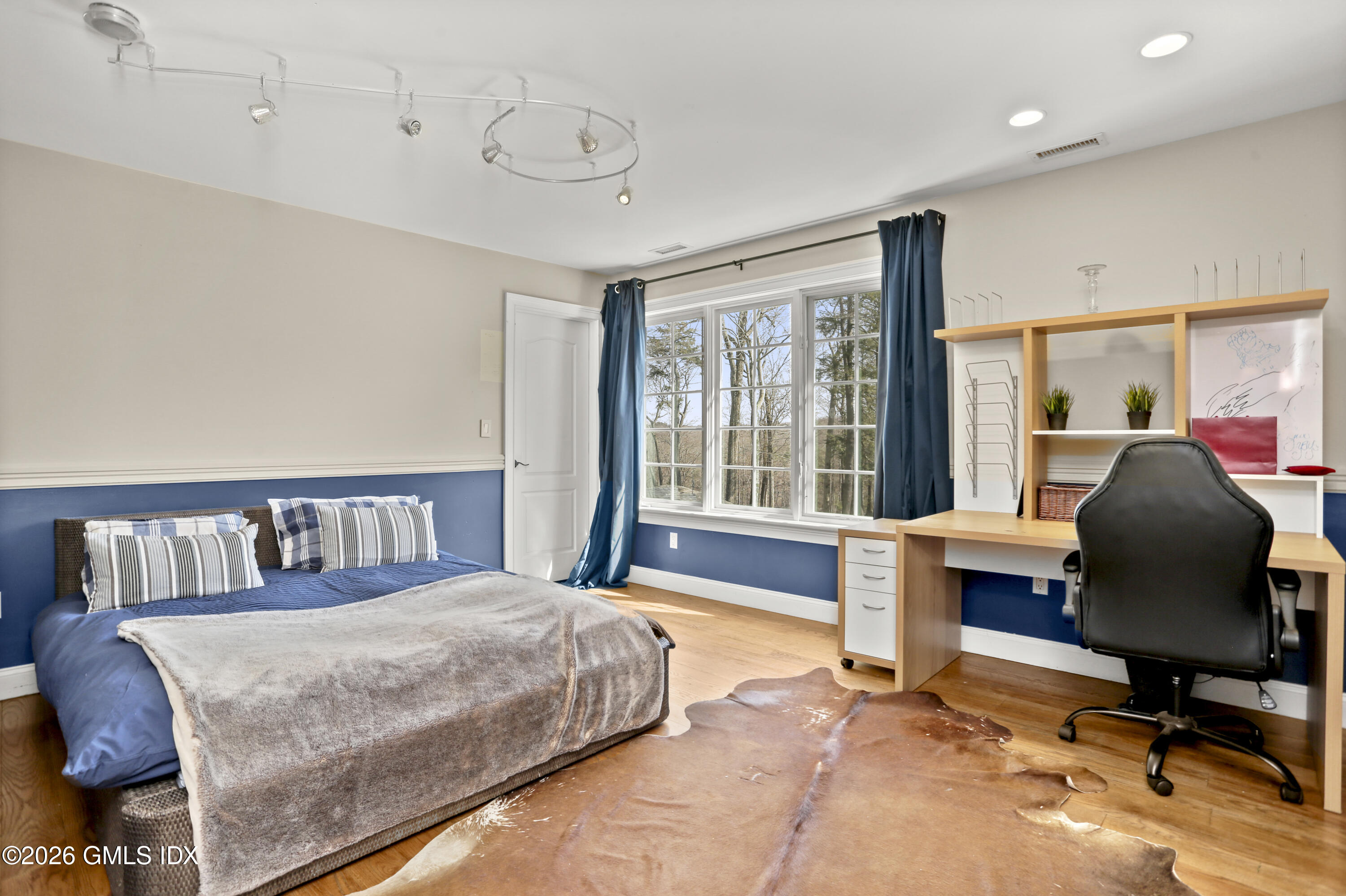 367 Riversville Road Greenwich, CT 06831 - Photo 51 of 66 a bedroom with a bed chair and a large window