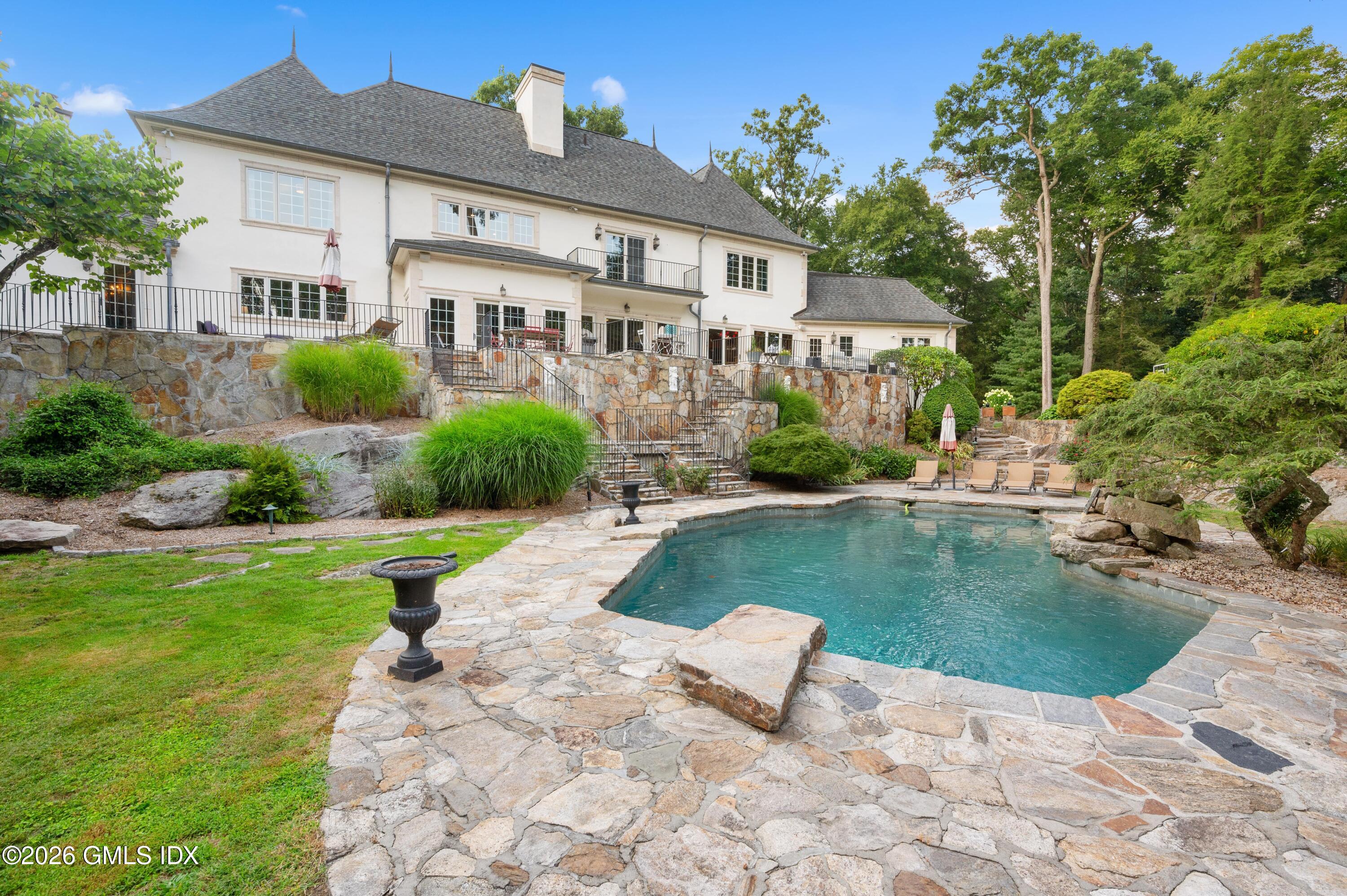 367 Riversville Road Greenwich, CT 06831 - Photo 52 of 66 a view of a house with a yard