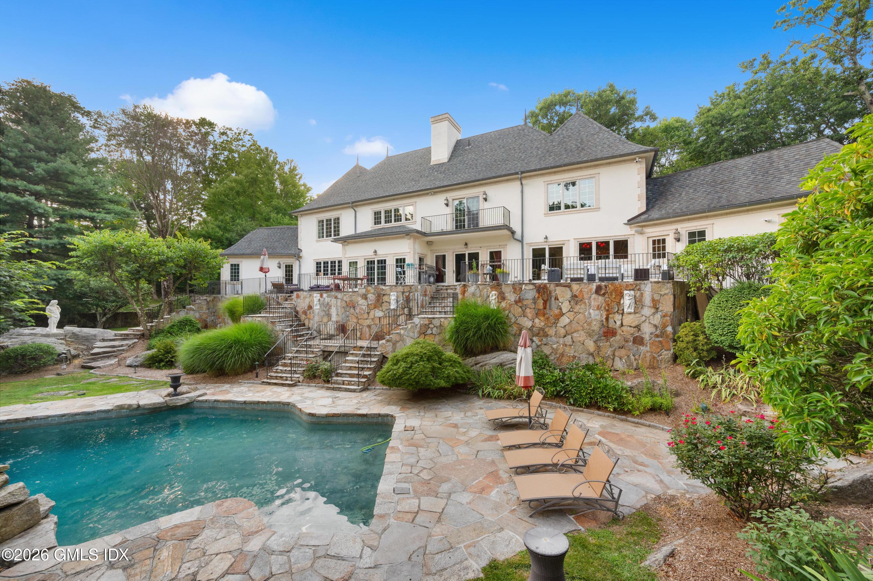 367 Riversville Road Greenwich, CT 06831 - Photo 53 of 66 a front view of a house with garden