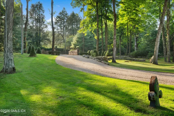 a view of a hallway with entryway wooden floor and front door