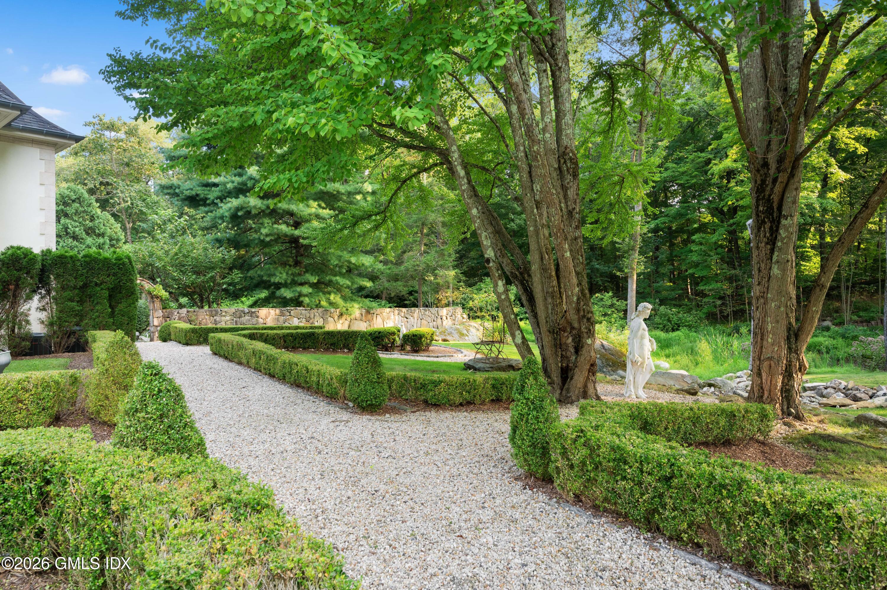 367 Riversville Road Greenwich, CT 06831 - Photo 7 of 66 a view of a park with large trees