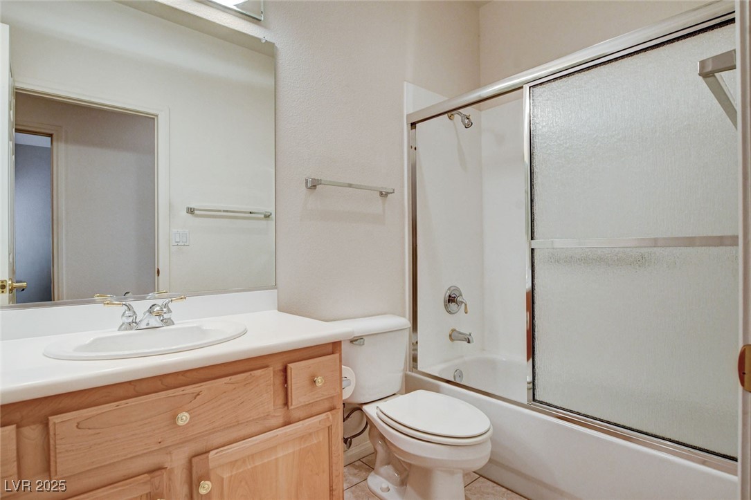 1104 Endora Way Boulder City, NV 89005 - Photo 18 of 36 Full bath featuring combined bath / shower with glass door, vanity, and light tile patterned floors