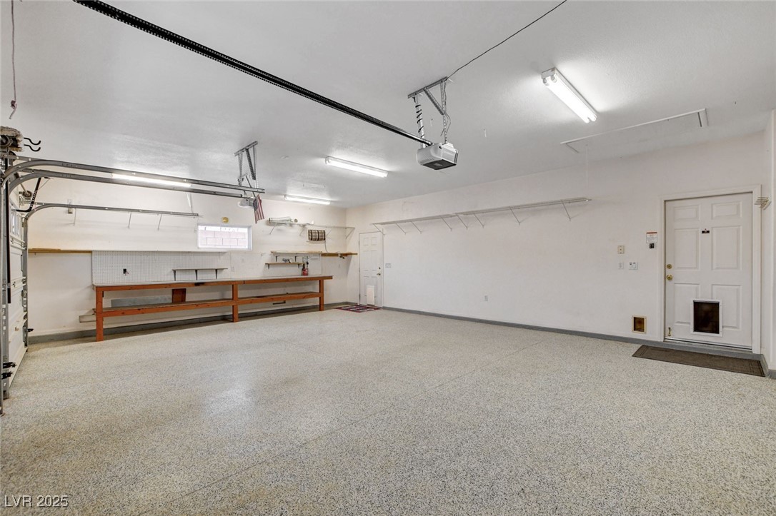 1104 Endora Way Boulder City, NV 89005 - Photo 21 of 36 Garage featuring baseboards and a garage door opener