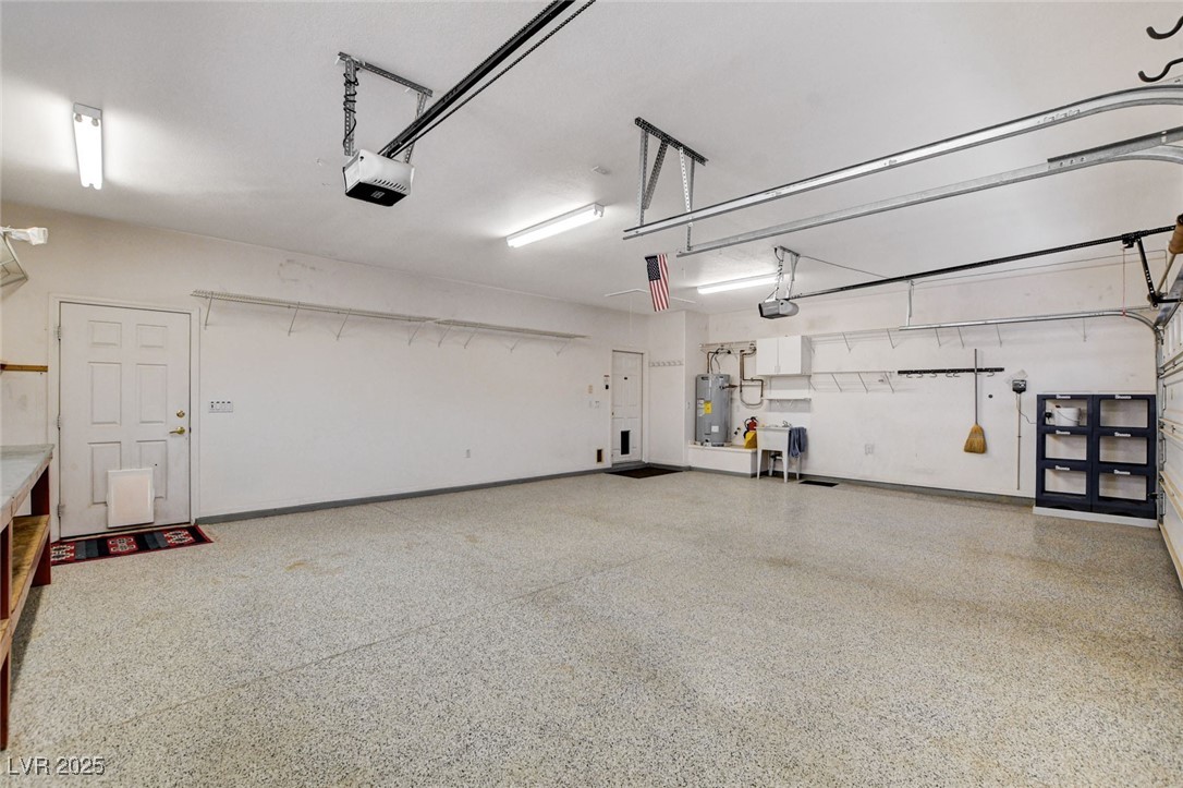 1104 Endora Way Boulder City, NV 89005 - Photo 22 of 36 Garage with electric water heater and a garage door opener