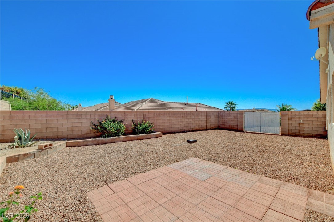 1104 Endora Way Boulder City, NV 89005 - Photo 26 of 36 Fenced backyard featuring a patio area