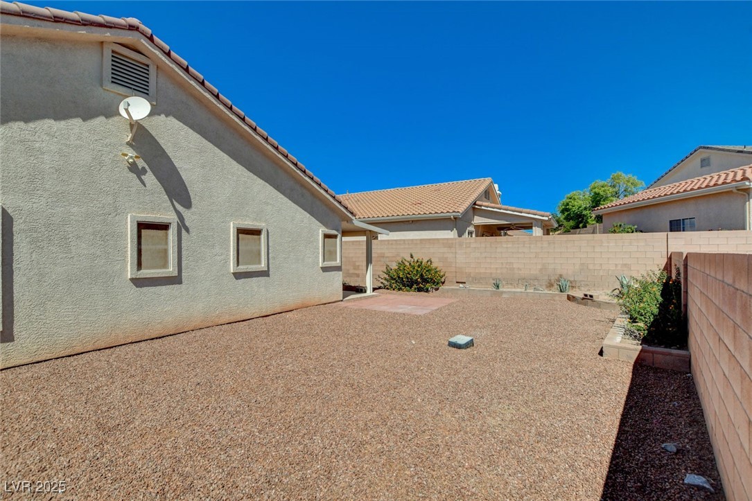 1104 Endora Way Boulder City, NV 89005 - Photo 28 of 36 Fenced backyard with a patio