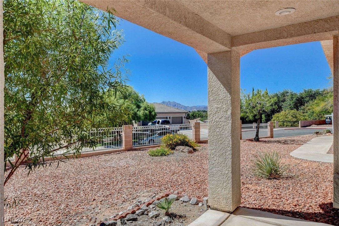 1104 Endora Way Boulder City, NV 89005 - Photo 34 of 36 Fenced front yard featuring a gate and a mountain view